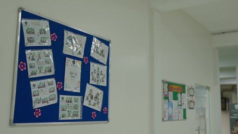An interior corridor in one of the modern schools in the Kingdom of Saudi Arabia, contemporary interior design, organized educational environment, educational boards in the school.