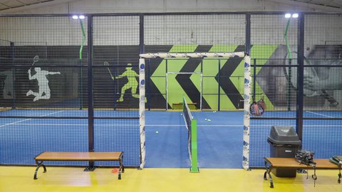 A spacious playground in one of the modern schools in the Kingdom of Saudi Arabia, practicing sports activities and football, with a green grass surface, focusing on health and physical fitness.