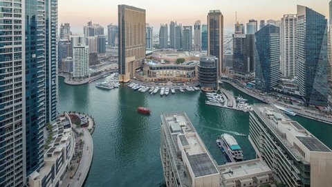 Dubai Marina Marina and Marina, the architectural art of buildings and structures overlooking the sea, the growth and urban development of towers and skyscrapers in the United Arab Emirates, famous tourist attractions in Dubai, the waterfront overlooking the Arabian Gulf coast