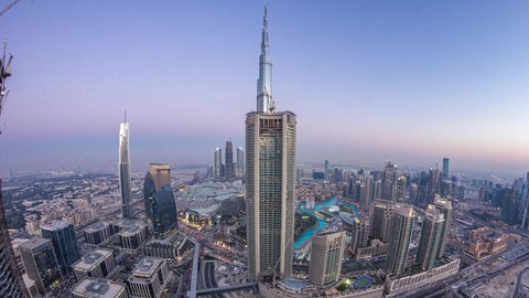 Famous tourist attractions in the United Arab Emirates, attracting tourists from all over the world, paved streets and roads, car traffic, buildings and commercial facilities in Dubai, the architectural art of building towers and skyscrapers in a modern style