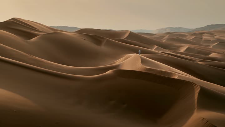 Sand formations and formations in deserts, soft golden dunes and natural terrain in the United Arab Emirates, harsh and dry weather in arid lands, landscapes and soft golden sand in the desert, nature background