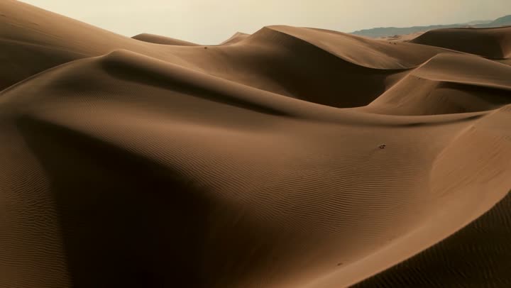 Harsh and dry weather in arid lands, soft golden dunes and natural terrain in the United Arab Emirates, landscape and soft golden sand in the desert, sand formations and formations in deserts, nature background