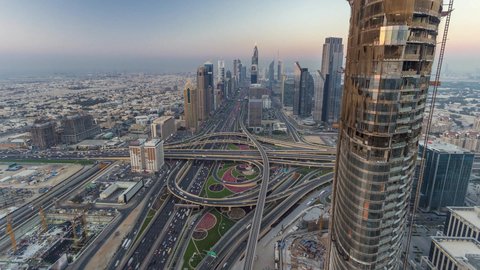 Paved roads and streets, traffic, commercial buildings and facilities in Dubai, the architectural art of building towers and skyscrapers in a modern style, famous tourist attractions in the United Arab Emirates, attracting and attracting tourists from all over the world