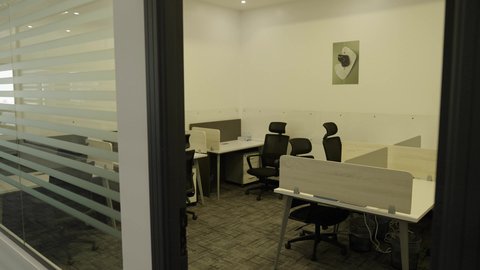 Modern office equipment with elegant and comfortable furniture, sophisticated interior designs and decorations in a modern style, contemporary design for offices of companies in the Kingdom of Saudi Arabia, large glass facades in the workplace.