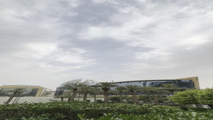 The evolution of architectural engineering art in the modern style, famous tourist places and landmarks to attract tourists from all over the world, a close-up shot of the famous Kingdom Tower in Riyadh, towers and skyscrapers, famous buildings and commercial landmarks in Saudi Arabia.