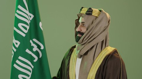 Flag Day March 11, Saudi National Day September 23, portrait of a Saudi Arabian Gulf man wearing a bisht, ghutra and agal, Founding Day raising the Saudi flag, the day we began 1727 AD, the anniversary of the founding of the first Saudi state on February 22