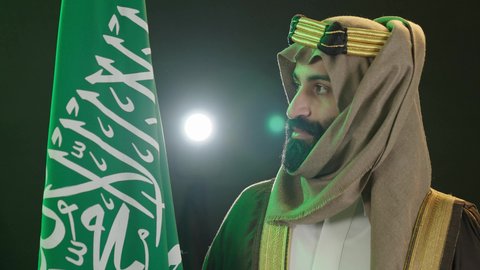 Saudi National Day commemoration, September 23, the anniversary of the founding of the first Saudi state on February 22, Flag Day, March 11, the day we began in 1727 AD, a portrait of a Saudi Arabian Gulf man wearing a bisht, ghutra and agal on the founding day raising the Saudi flag