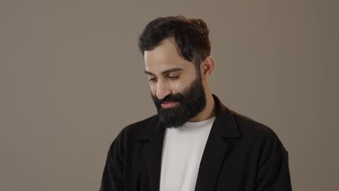 Practicing the hobby of reading, the concept of passion for reading, a portrait of a Saudi Arabian Gulf man wearing casual clothes holding a book, quiet, comfortable places to study