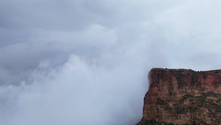 Rock formations and structures, places that attract and draw tourists from around the world, drone footage of the Al-Habala tourist park in the Asir region, hills and mountainous elevations in Saudi Arabia, natural tourist attractions in the Kingdom, the cloudy sky.