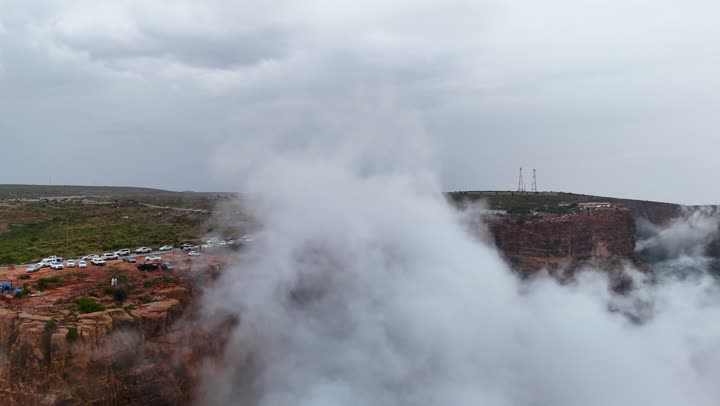 Rock formations and structures, places that attract and draw tourists from around the world, drone footage of the Al-Habala tourist park in the Asir region, hills and mountainous elevations in Saudi Arabia, natural tourist attractions in the Kingdom, the cloudy sky.