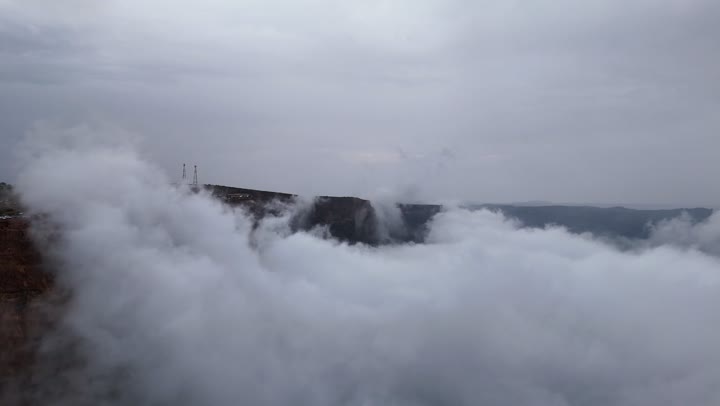 Tourist attractions and destinations for visitors from around the world, drone photography of the Al-Habala tourist park in the Asir region, the hills and mountainous elevations in Saudi Arabia, rock formations and structures, natural tourist landmarks in the Kingdom, the cloudy sky.