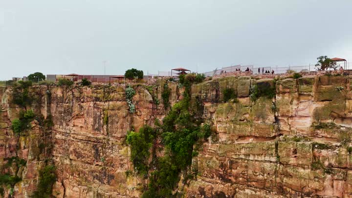 Rock formations and structures, places that attract and draw tourists from around the world, drone footage of the Al-Habala tourist park in the Asir region, hills and mountainous elevations in Saudi Arabia, natural tourist attractions in the Kingdom, the cloudy sky.
