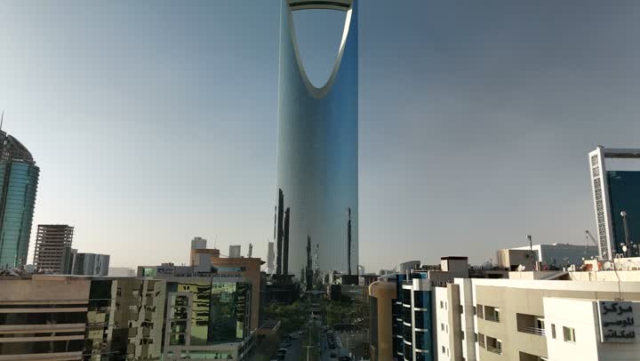 Famous buildings and landmarks in Saudi Arabia, modern and sophisticated architectural art, an aerial view of the famous Kingdom Tower in Riyadh, towers and skyscrapers, growth, development and urban progress, lifestyle in the capital