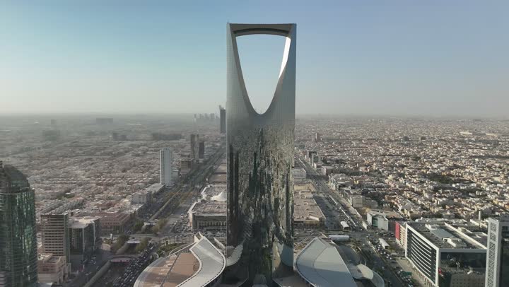 Growth, development and urban progress, lifestyle in the capital, famous buildings and landmarks in Saudi Arabia, advanced and modern architectural art, aerial photography of the famous Kingdom Tower in Riyadh, towers and skyscrapers