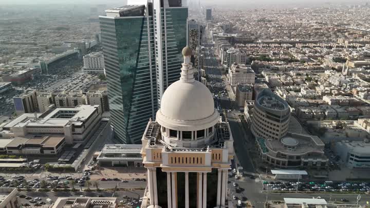 Attracting tourists from all over the world, the architectural art of commercial establishments in the capital during the day, an aerial drone shot of the Narcissus Hotel in Riyadh, Saudi Arabia, the urban growth and progress of towers and skyscrapers, a famous tourist attraction