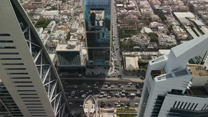 Aerial drone photography of famous places and landmarks in the Kingdom of Saudi Arabia, Al Wasil Tower and the Ministry of Islamic Affairs, Endowments, Call and Guidance in Al Olaya during the day, architectural art of buildings and skyscrapers in Riyadh
