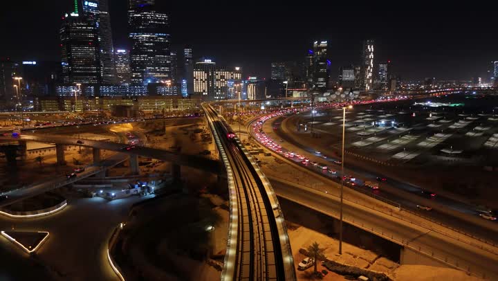 The architectural art of modern commercial and residential buildings and facilities, the traffic in the capital's illuminated streets at night, the interest in infrastructure in the city of Riyadh, the towers and skyscrapers in the Kingdom of Saudi Arabia, urban growth and progress.