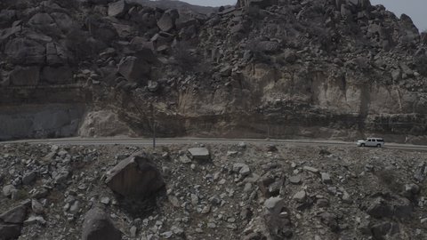 Mountains, rock formations, peaks and heights in historical landmarks, a famous tourist place and landmark, attracting tourists from all over the world, the mountainous environment in the Kingdom of Saudi Arabia, aerial drone photography of winding roads in the city of Al Baha