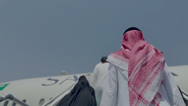 Transportation and air transport, providing advanced services for easy movement between countries in the Kingdom of Saudi Arabia, an airplane in Jeddah, the concept of tourism and travel, Saudi airlines and companies