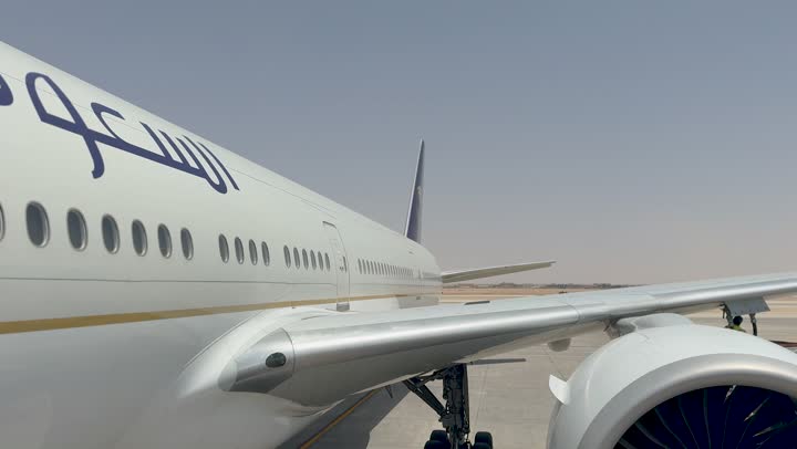 Transportation and air transport, providing advanced services for easy movement between countries in the Kingdom of Saudi Arabia, an airplane in Jeddah, the concept of tourism and travel, Saudi airlines and companies