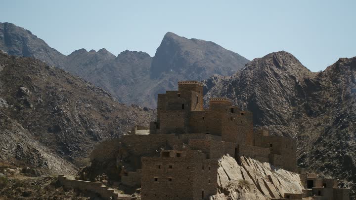 Simple mud houses and buildings in Abha, popular neighborhoods in the villages of the Kingdom of Saudi Arabia, ancient Arab architectural style, famous historical landmarks and heritage sites