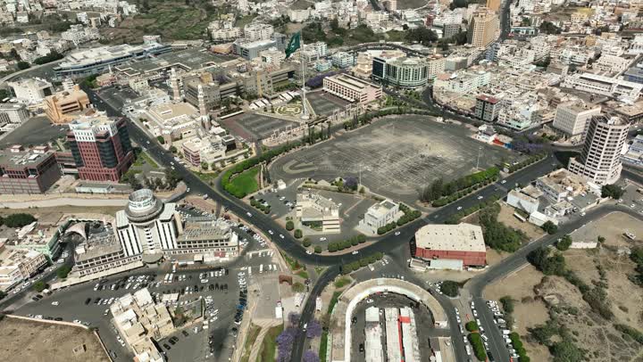 Neighborhoods and residential houses in the city of Abha in the Kingdom of Saudi Arabia, car traffic on asphalt streets, paved roads and streets, trees and green plants