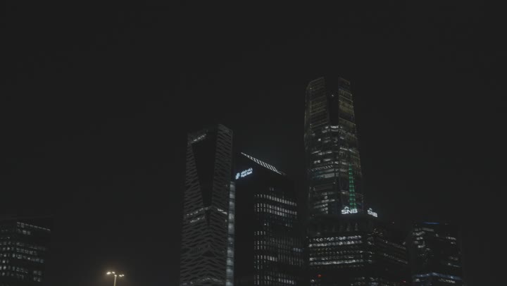 An outdoor night shot from KAFD Pan, tourism in Saudi Arabia, King Abdullah Financial Center (KAFD) in Riyadh, Saudi Arabia, financial and economic towers and architectural facilities, a stunning night view of the financial center.