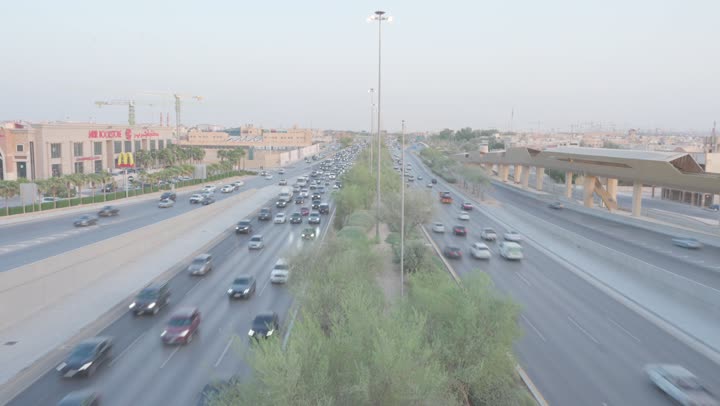 Traffic of cars on King Khalid Road in Riyadh, Saudi Arabia, roads and streets of Saudi Arabia, daytime traffic, transportation and public transport in Saudi Arabia.