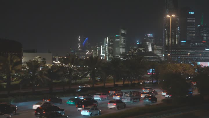 The growth and urban development in Saudi Arabia, the architectural engineering art of the famous buildings and skyscrapers in the Kingdom, achieving economic and commercial renaissance, the financial towers in Riyadh, and the traffic movement of cars in front of the King Abdullah Financial Center (KAFD).