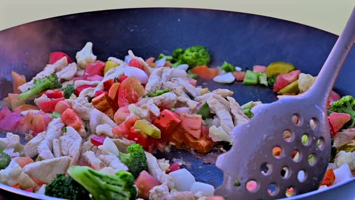 Preparing food on the griddle, cooking a variety of different Saudi dishes and beverages, close-up shots of a Gulf Arab Saudi chef preparing food for serving.