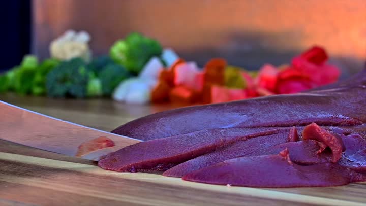 Preparing food on the griddle, cooking a variety of different Saudi dishes and beverages, close-up shots of a Gulf Arab Saudi chef preparing food for serving.