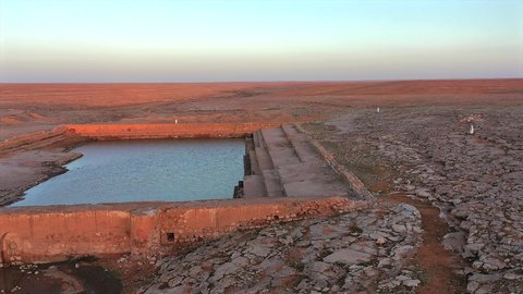 Watering Ain Zubaydah in Mecca, Saudi Arabia, drone footage of Al-Ashar Pool during the day, an ancient historical endowment, endowments serving pilgrims and Umrah performers, famous historical monuments
