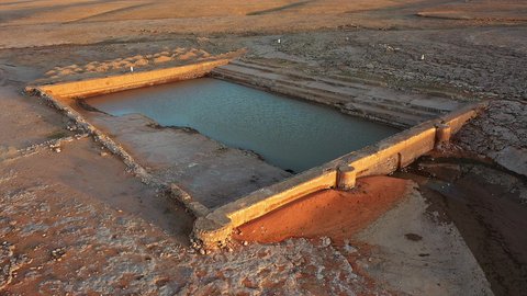 Watering Ain Zubaydah in Mecca, Saudi Arabia, drone footage of Al-Ashar Pool during the day, an ancient historical endowment, endowments serving pilgrims and Umrah performers, famous historical monuments