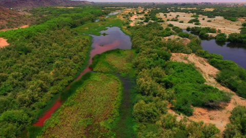 Bird migration season, natural tourist attractions in the Kingdom of Saudi Arabia, places that attract tourists from all over the world, drone photography of Wadi Hali in the west of the Kingdom, migratory birds over the lake