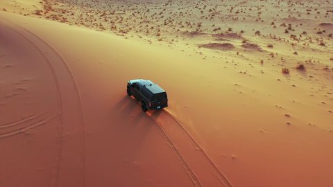 An exciting safari adventure on the sand dunes and hills, a fun recreational activity, safari trips in the deserts of the Kingdom of Saudi Arabia, spending a special trip in the desert environment, driving a jeep (drifting) in the middle of the desert