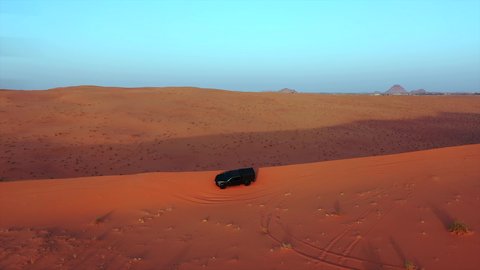 An exciting safari adventure on the sand dunes and hills, a fun recreational activity, safari trips in the deserts of the Kingdom of Saudi Arabia, spending a special trip in the desert environment, driving a jeep (drifting) in the middle of the desert