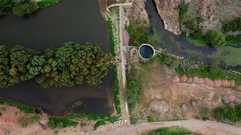 Drone photography of Wadi Jawf Al-Ashwat in Sarat Ubaidah, natural tourist attractions in the Kingdom of Saudi Arabia, rock formations and formations, green plants growing on hills and mountain heights in the Kingdom of Saudi Arabia, places that attract tourists from all over the world.
