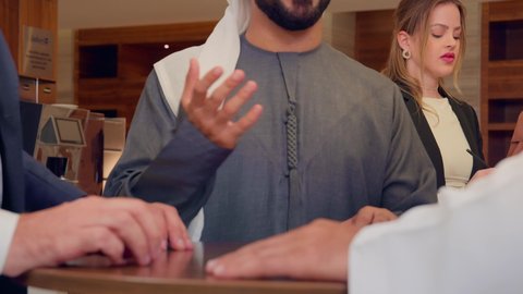 Receiving foreign delegations, concluding new business deals, agreeing on commercial projects, a meeting of a team of Arab Gulf Emiratis with a foreign delegation in a luxurious conference hall, discussion and exchange of ideas among businessmen, a business exhibition in the United Arab Emirates with representatives.