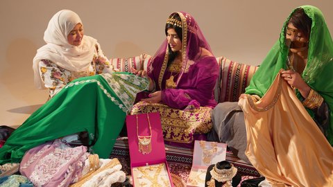 Wedding ceremonies in the UAE involve preparing the bride, an Emirati Gulf Arab woman accompanied by the groom's mother, who gifts the bride an exquisite embroidered jalabiya on the occasion of her wedding, with gestures of happiness and joy.