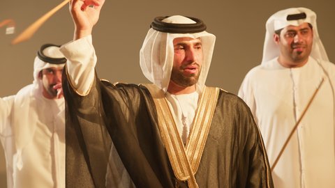 The celebrations at Emirati weddings showcase loyalty and love for the homeland, featuring folk theatrical performances and traditional dances during weddings and national events. Close-up photography brings to life the wonderful atmosphere of an Emirati Gulf Arab groom, with the Al Ayala performance group enlivening the event, a performing art that combines dance and the ghazal.