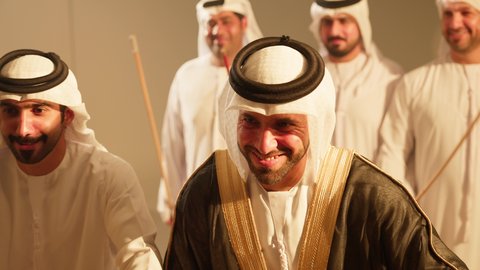 Popular theatrical performances, folk dances at weddings and national events, creating a wonderful atmosphere for an Emirati Gulf Arab groom, the celebration is led by the Al Ayala performance troupe, a performing art that combines dance and the ghazal, celebrations at Emirati weddings, expressing loyalty and love for the homeland, national customs and traditions.