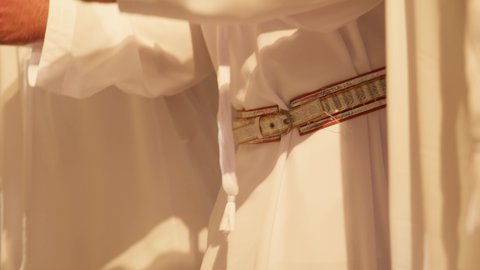 Folk dances at national events, festivals, and holidays, wearing traditional attire at a national occasion, a folklore performance troupe, Union Day on December 2nd and 3rd, celebrating the national holiday with the traditional dance of Al Ayala, which is part of the traditional attire of the UAE, close-up shot of a folk dance Al Ayala.