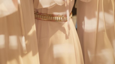 Union Day is on December 2nd and 3rd, folk dances during national occasions, festivals, and holidays, wearing traditional attire on a national occasion, a folklore performance troupe, celebrating the national holiday with the traditional stick dance is part of the traditional attire of the UAE, close-up shot of the folk dance Al Ayala.