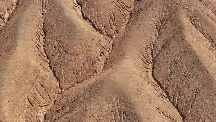 Natural volcanic fields, mountains, and volcanic craters in the Khaybar Lava Field, landmarks of Medina, a destination for tourists and earth scientists, natural places in the Kingdom of Saudi Arabia.