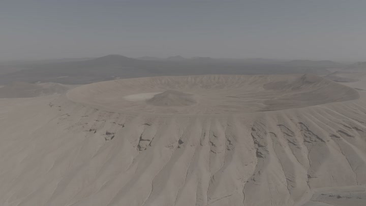 Natural volcanic fields, mountains, and volcanic craters in the Khaybar Lava Field, landmarks of Medina, a destination for tourists and earth scientists, natural places in the Kingdom of Saudi Arabia.