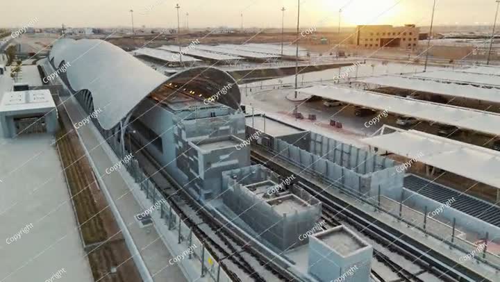 A metro train rides to a modern station in the city of Riyadh