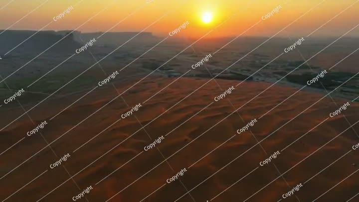 Aerial Panning Scenic Shot Of Tranquil Red Sand Dunes During Sunset - Riyadh,