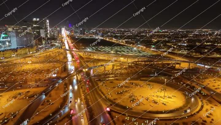 Nighttime Aerial View of Riyad City Lights and Highways. KAFD
