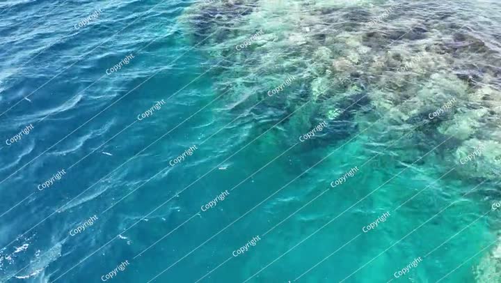 Aerial view drone flying over blue sea. Beautiful sea waves and coral reef water