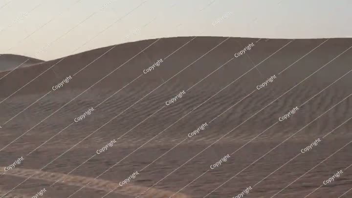 Desert sand dunes on a cloudy day